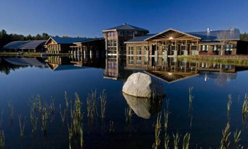 reflection of building on still lake