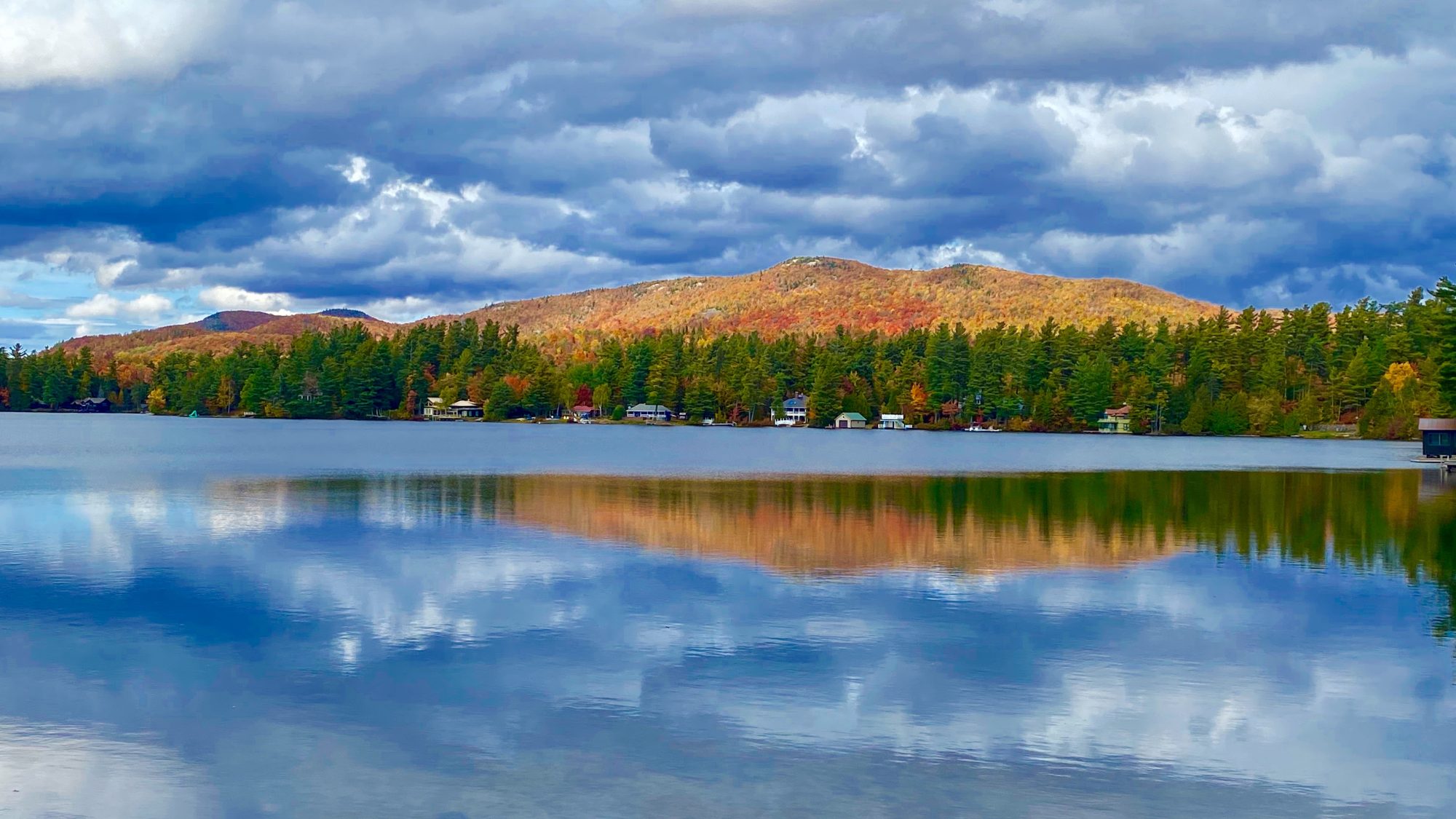 fall mountains reflecting on calm lake