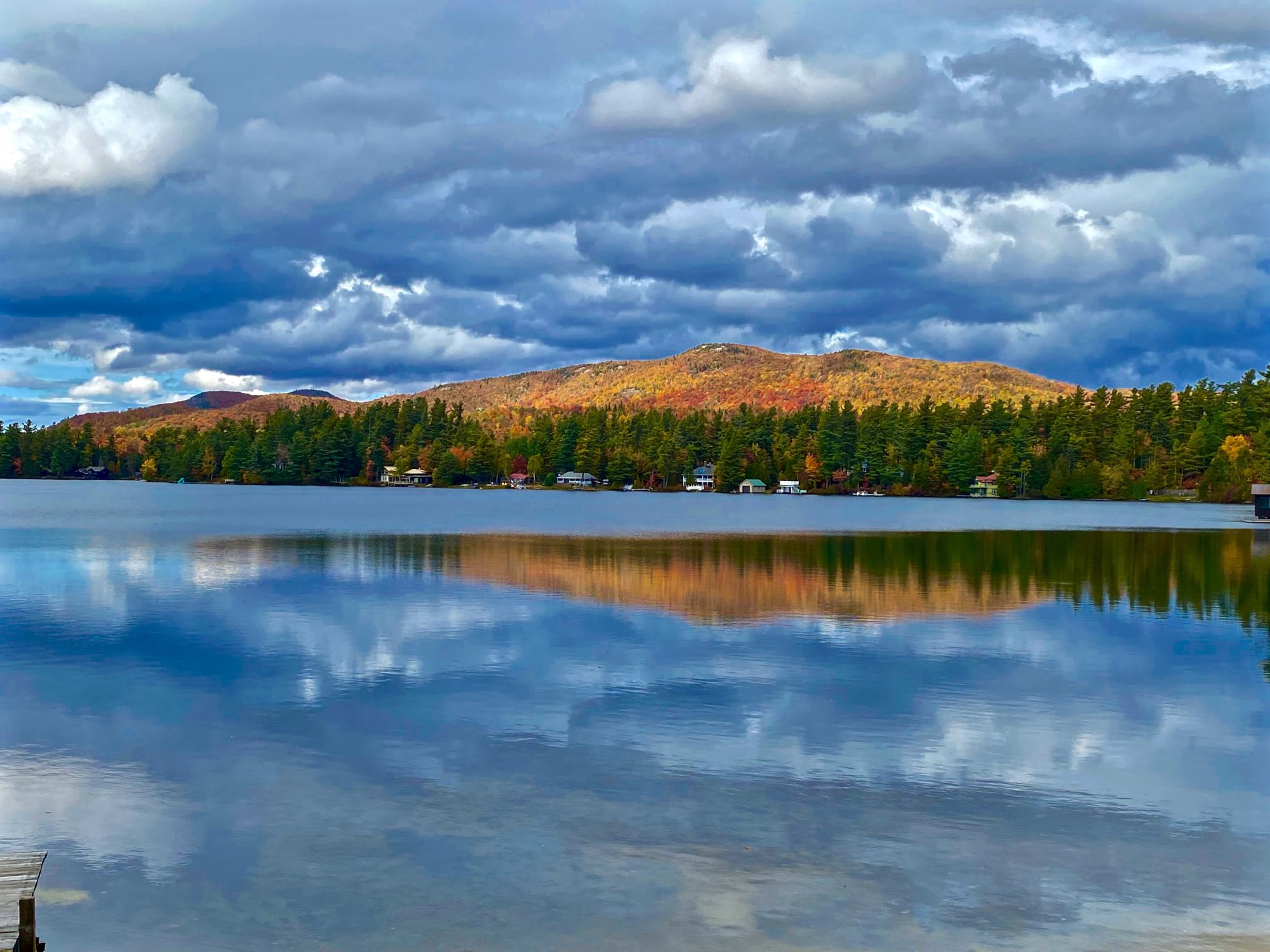 reflection of fall mountains on loon lake