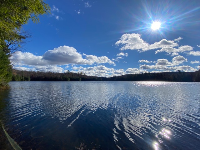 sunny day with blue skies over adirondack lake